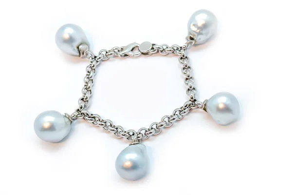 Silver bangles featuring vibrant turquoise stone inlays -South Sea Cultured Pearl Charm Bracelet