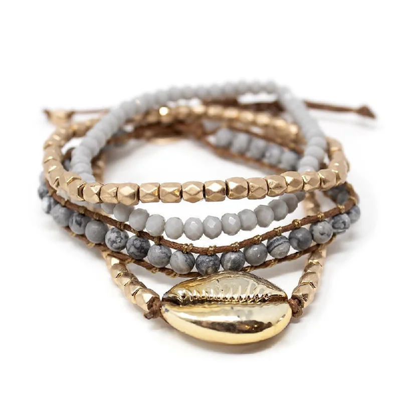 Bangles with blue quartz for cool tones -Gold Tone Cowrie Shell Bead Stretch Bracelet Set of Four Gray