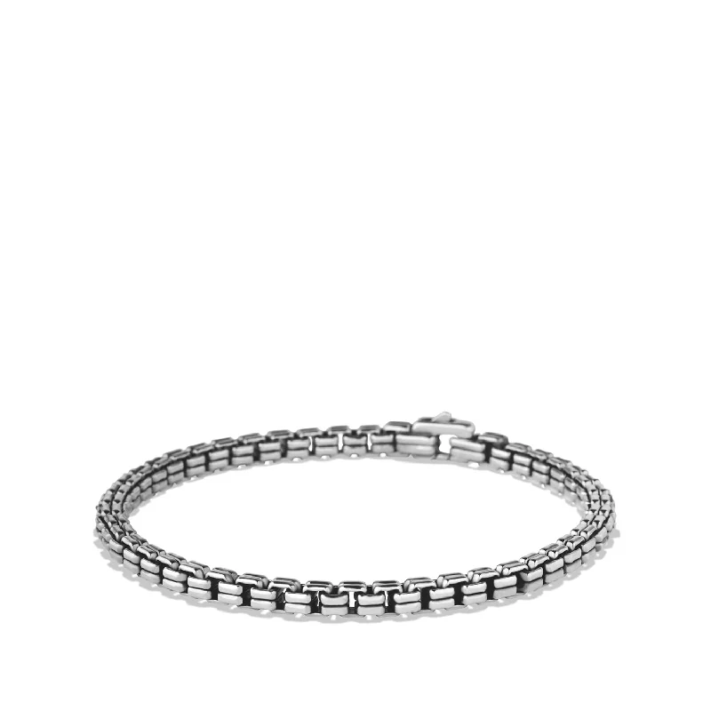 Silver bangles with polished mirror finish shine -David Yurman   Bracelet in Sterling Silver