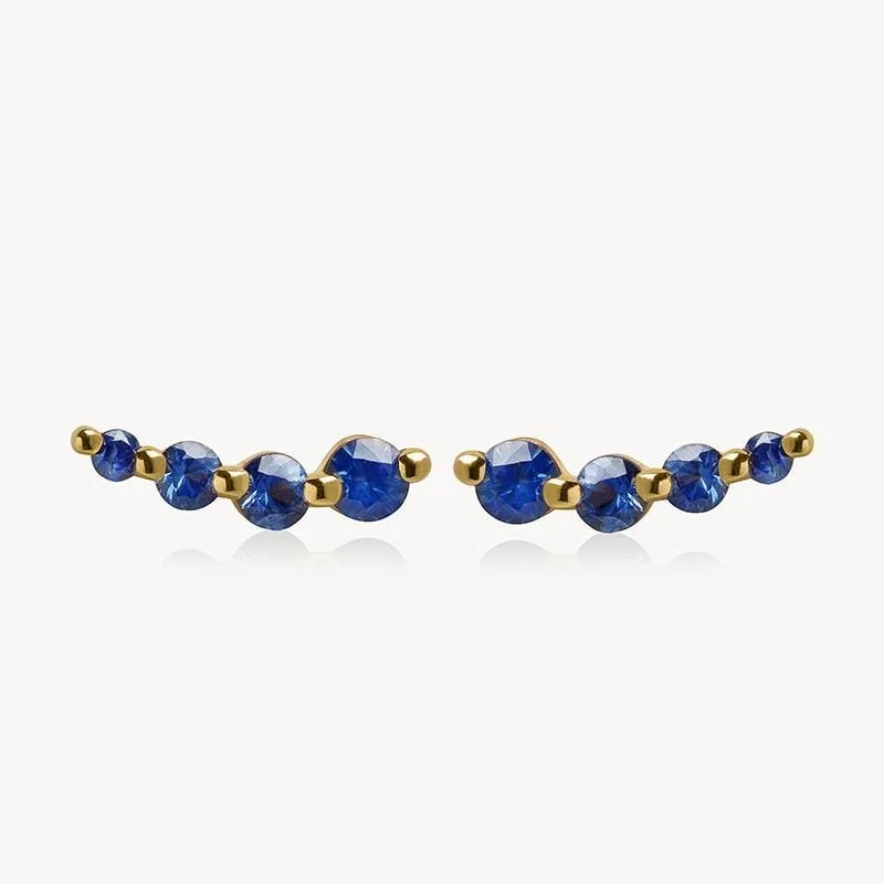 Hoop earrings with leather accents for a sleek and bold combination-Curved Sapphire Studs